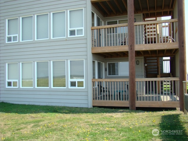 back of house with a lawn