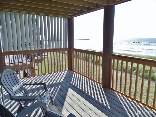 wooden deck with a water view