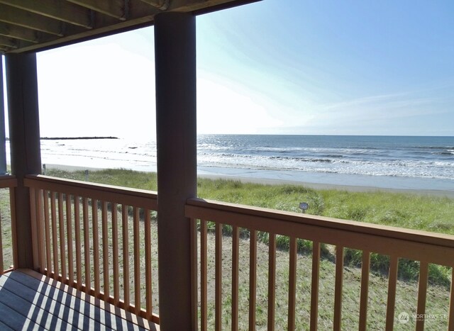 exterior space featuring a water view and a view of the beach