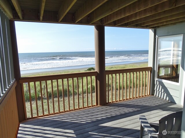 wooden deck with a water view