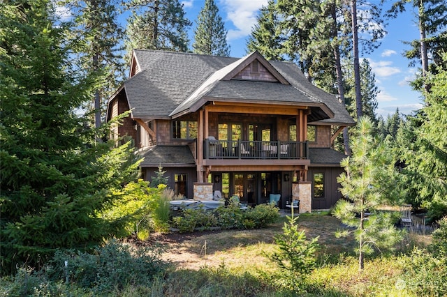 rear view of house with a balcony