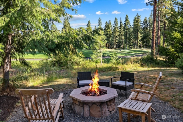 view of terrace with an outdoor fire pit