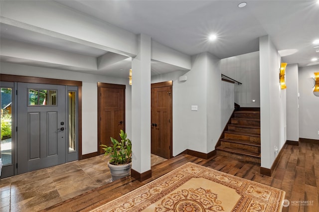 foyer featuring dark wood-type flooring
