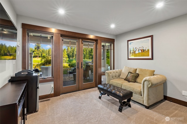 carpeted living room with french doors