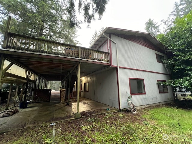 view of side of home featuring a wooden deck