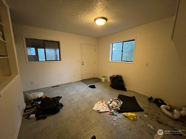 spare room featuring a textured ceiling