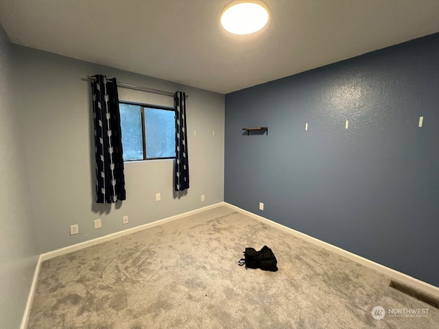 view of carpeted spare room