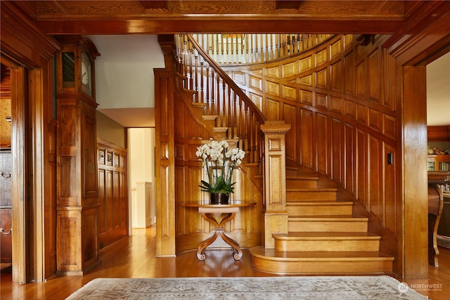 stairway featuring light hardwood / wood-style floors