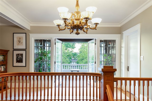 interior space with crown molding and an inviting chandelier