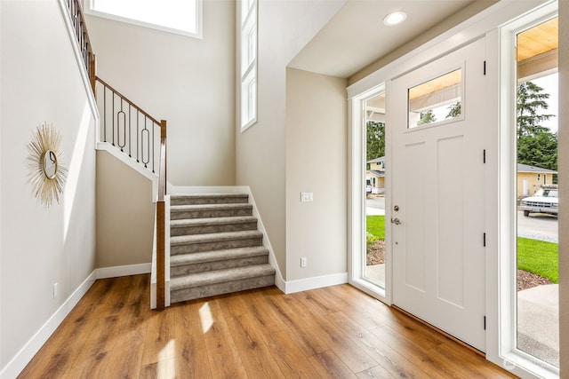 entrance foyer with wood-type flooring and a wealth of natural light