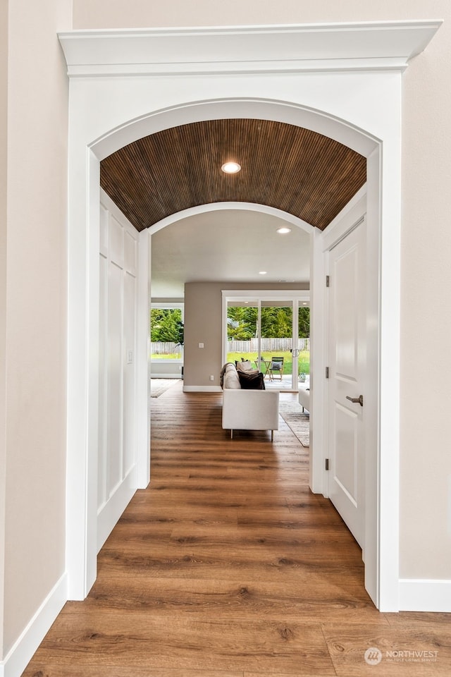 corridor with wood ceiling and wood-type flooring