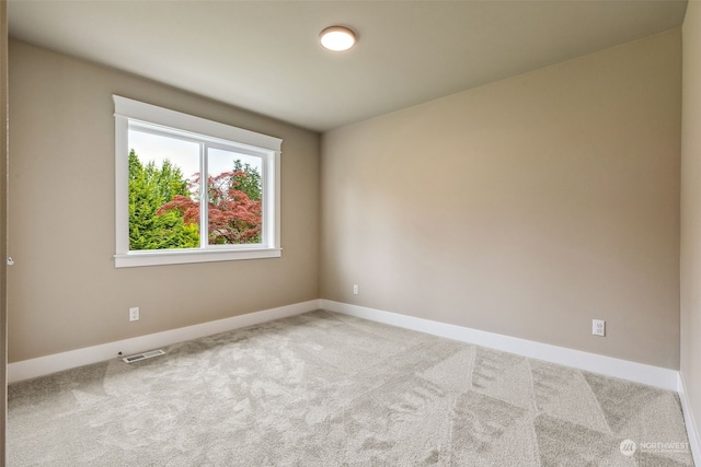 spare room with carpet floors