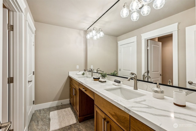 bathroom with vanity and an inviting chandelier