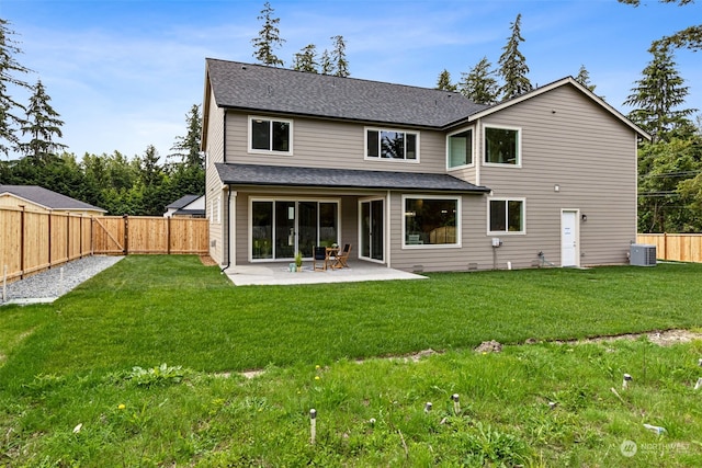 back of property featuring a lawn, cooling unit, and a patio