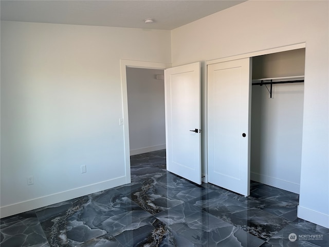 unfurnished bedroom featuring a closet