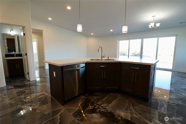 kitchen featuring pendant lighting, dishwasher, a center island with sink, and sink