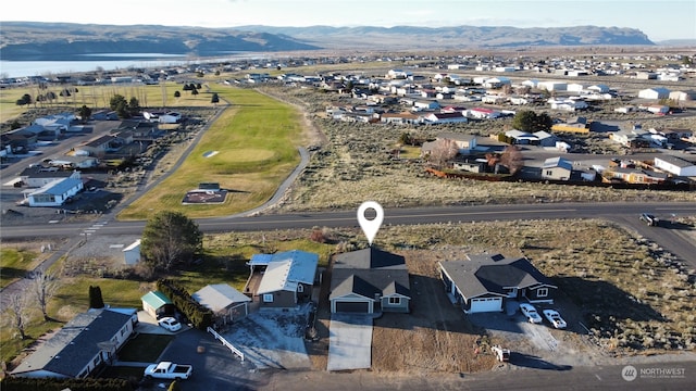 drone / aerial view featuring a mountain view