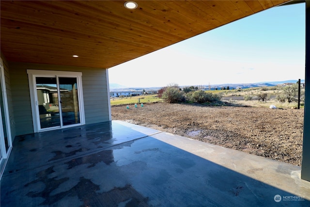 view of patio / terrace featuring a mountain view