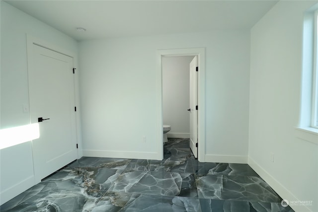 bedroom featuring ensuite bathroom