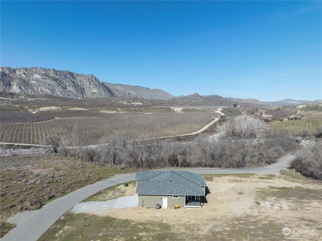 birds eye view of property featuring a rural view and a mountain view