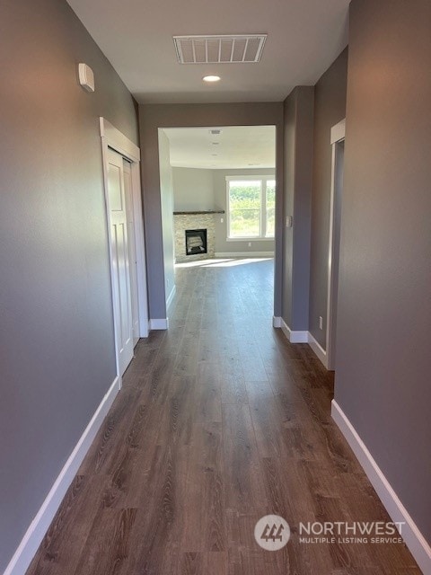 hallway featuring dark wood-type flooring