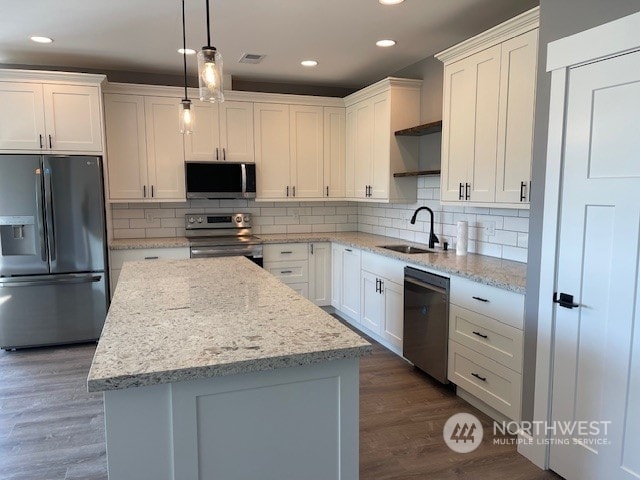 kitchen with sink, dark hardwood / wood-style flooring, white cabinets, and appliances with stainless steel finishes