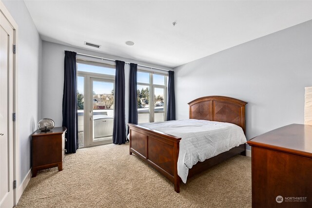 1501 Tacoma Ave S Unit 603, Tacoma, WA 98402 - bedroom featuring light colored carpet and access to exterior