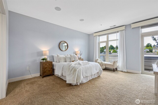 1501 Tacoma Ave S Unit 603, Tacoma, WA 98402 - carpeted bedroom featuring baseboards, vaulted ceiling, and access to exterior