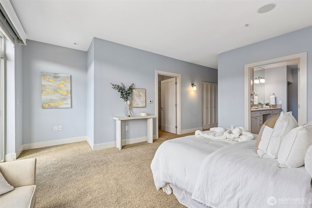1501 Tacoma Ave S Unit 603, Tacoma, WA 98402 - bedroom with light colored carpet, baseboards, and ensuite bathroom