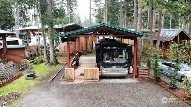 view of parking / parking lot with a carport