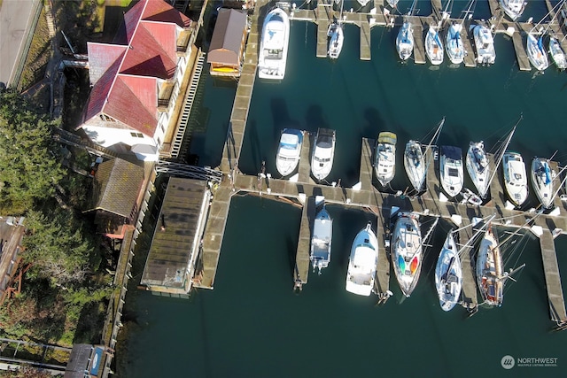 birds eye view of property featuring a water view