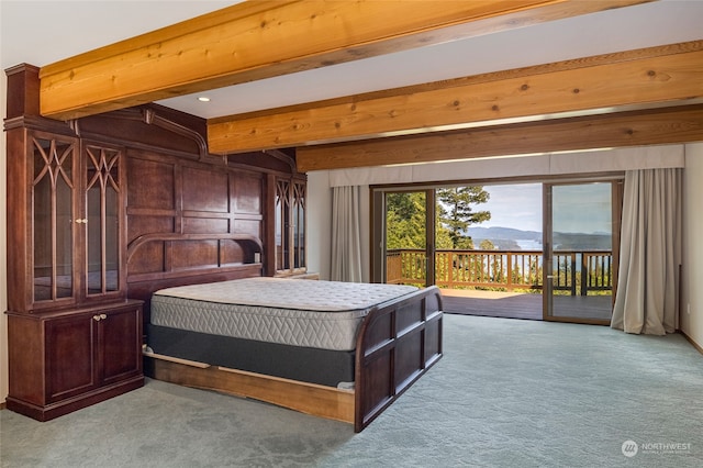 carpeted bedroom featuring access to exterior, a mountain view, and beam ceiling