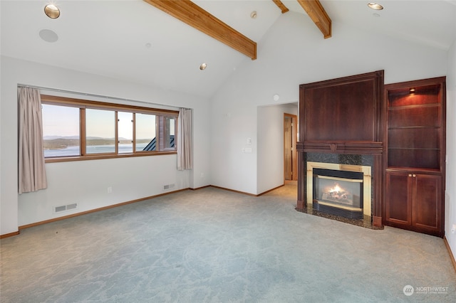 unfurnished living room featuring light colored carpet, high vaulted ceiling, and beamed ceiling