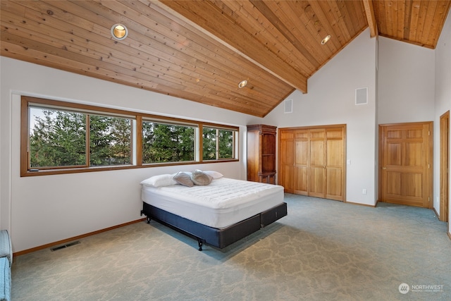 bedroom featuring high vaulted ceiling, light carpet, and beamed ceiling