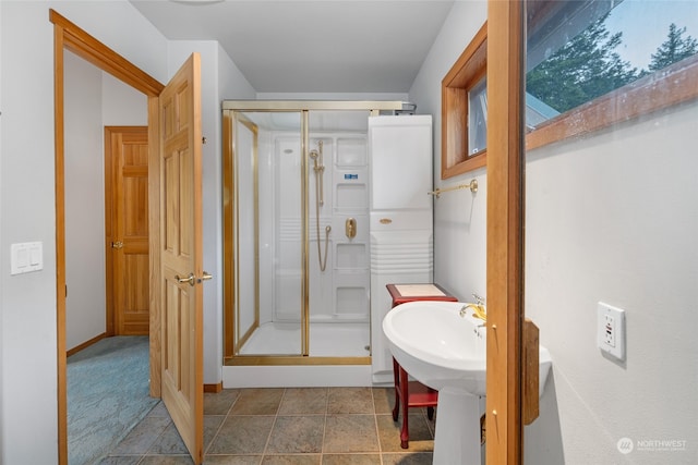 bathroom featuring tile flooring and walk in shower