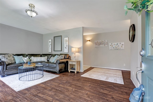 living room with dark hardwood / wood-style flooring