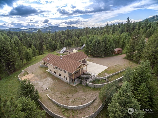 drone / aerial view featuring a mountain view