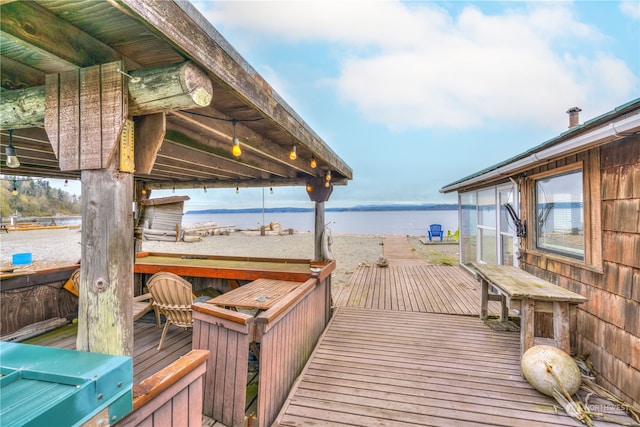 deck featuring a water view