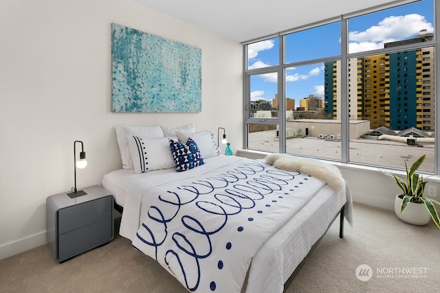 bedroom featuring light colored carpet