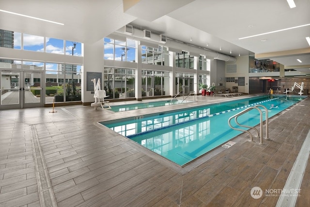 view of pool with french doors