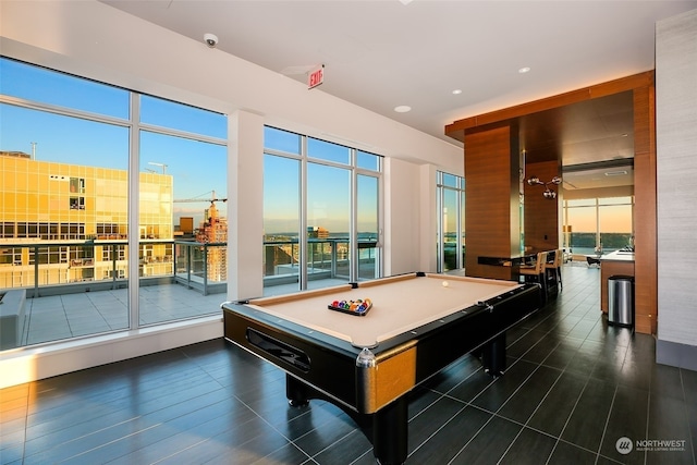 playroom with dark wood-type flooring and pool table