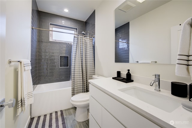 full bathroom featuring shower / tub combo, tile floors, toilet, and vanity