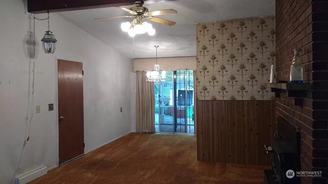 empty room with ceiling fan with notable chandelier, a baseboard radiator, a brick fireplace, carpet, and lofted ceiling with beams