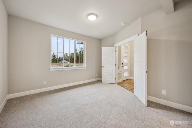 unfurnished bedroom with light carpet