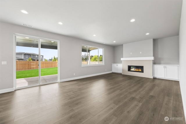 unfurnished living room featuring wood-type flooring