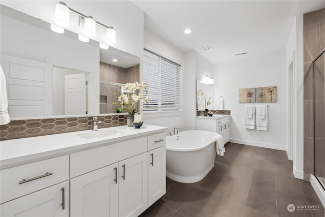 bathroom with vanity, separate shower and tub, and backsplash