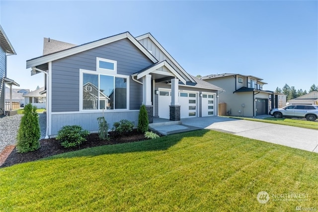 view of front of property featuring a garage and a front lawn