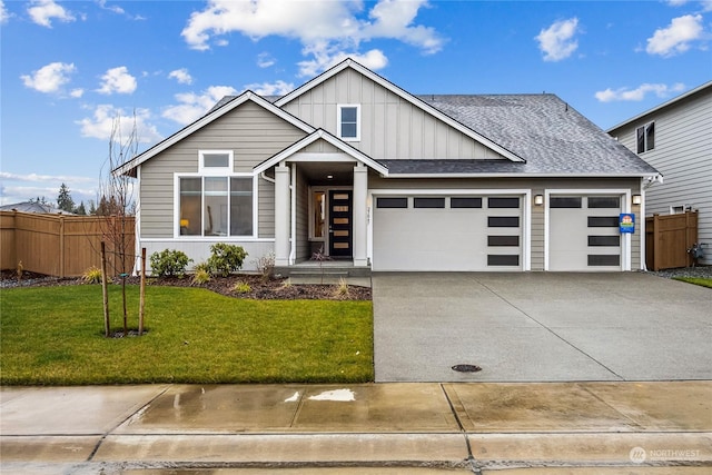 view of front facade with a garage and a front lawn