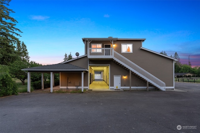 view of front of house featuring a balcony