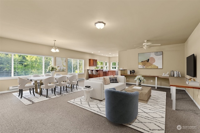 living room with light carpet and ceiling fan with notable chandelier